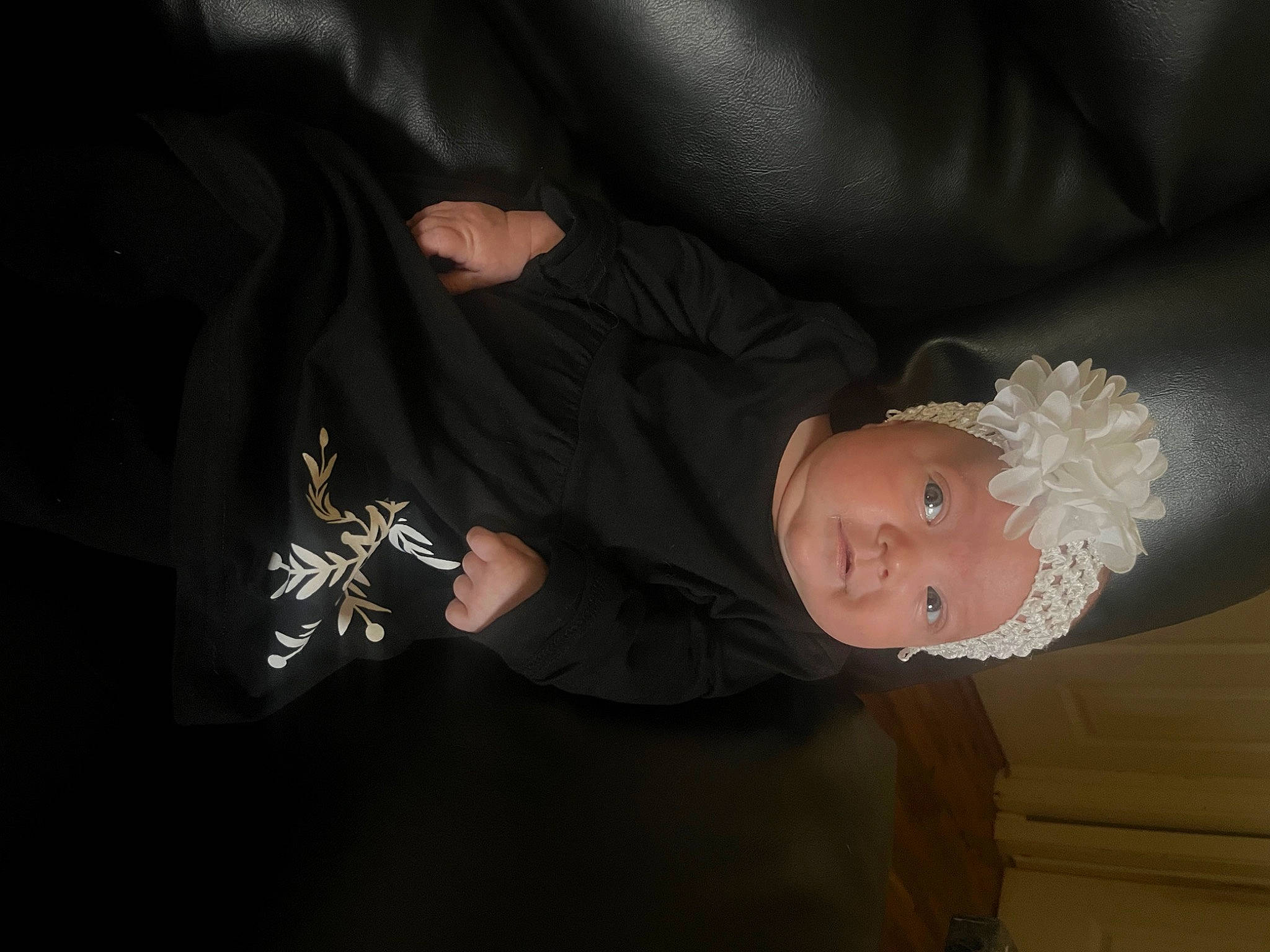Kayden is registered to the contest to win money with this photo: baby, baby_products, baby_toddler_clothing, comfort, costume_hat, darkness, elbow, event, fashion_accessory, flash_photography, gesture, nail, person, room, sitting, sleeve, thumb, toddler, wrist