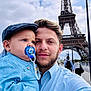 Ghael a rejoint le concours — aidez-le/la à gagner de superbes lots ! baby, backpack, blue_clothing, cap, cloudy, eiffel_tower, facial_hair, family, hand_holding, lamp_post, landmark, man, outdoor, pacifier, portrait, selfie, sky, street, tourist, travel