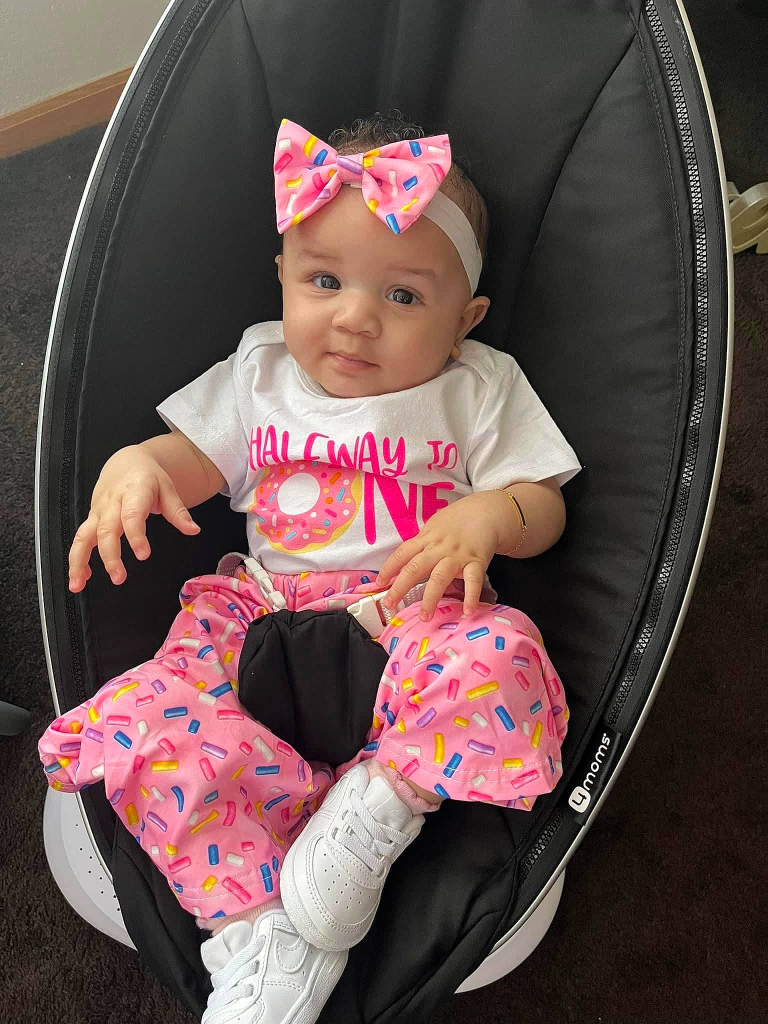 Brearie is registered to the contest to win money with this photo: baby, baby_carriage, baby_products, baby_toddler_clothing, cap, chair, child, clothing, comfort, headwear, magenta, pattern, person, pink, product, sitting, sleeve, smile, sock, t_shirt