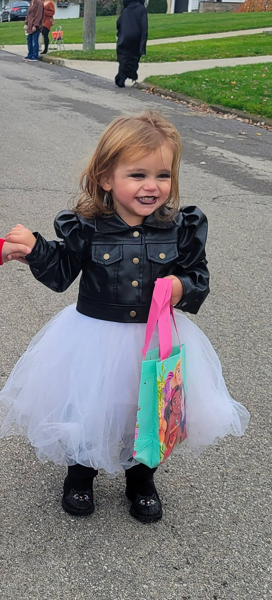 Leslie is registered to the contest to win money with this photo: asphalt, baby_toddler_clothing, child, costume, dress, event, fun, grass, happy, head, joy, magenta, pattern, people_in_nature, person, photograph, pink, play, sandal, sleeve