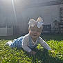 baby, bench, bow, child, crawling, daylight, denim_overalls, garden, grass, greenery, happy, headband, infant, nature, outdoor, plants, smiling, sunlight, toddler, wall