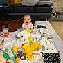 Amelya participe au concours pour gagner de l'argent avec cette photo : baby, black_couch, child, cozy, dog, floor, happy, horse, indoor, living_room, play_mat, plush_toys, sleeping_dog, smiling, stone_wall, stuffed_animal, toddler, toy_book, water_bottle, yellow_pillow