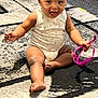 baby, child, infant, sitting, carpet, floor, pink_sunglasses, toy, happy, smiling, playful, indoor, cute, face, arms, legs, onesie, earrings, tongue, person