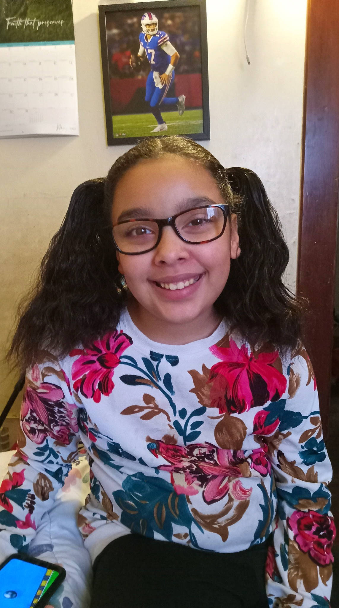 Kiara is registered to the contest to win money with this photo: arm, black_hair, cheek, chin, eye, eyebrow, face, forehead, glasses, happy, head, iris, joy, nose, organ, person, picture_frame, skin, sleeve, smile