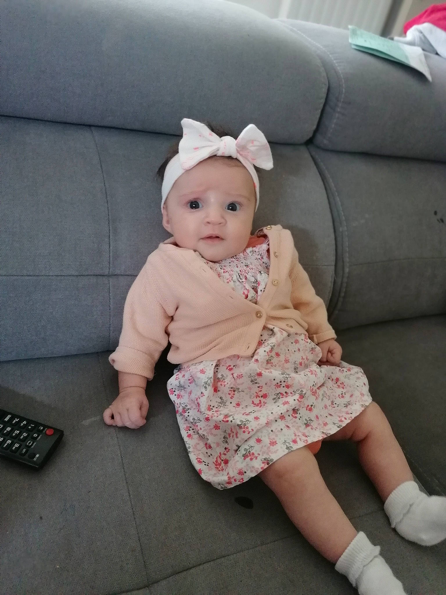 Katalyna participe au concours pour gagner de l'argent avec cette photo : answering_machine, baby, baby_toddler_clothing, cap, child, comfort, corded_phone, day_dress, headwear, human_leg, input_device, outerwear, pattern, person, pink, sitting, skin, sleeve, sock, telephone