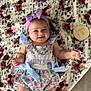 baby, infant, girl, smiling, headband, bow, dress, floral_blanket, milestone_marker, five_months, floor, cute, happy, lying_down, child, indoors, soft_texture, pattern, person, portrait