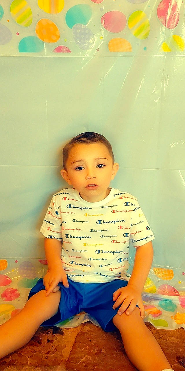 Malakai joined the competition — help win amazing prizes! baby, baby_toddler_clothing, cheek, child, child_model, chin, flash_photography, flooring, fun, hair, happy, pattern, person, portrait_photography, room, sitting, skin, sleeve, t_shirt, toddler