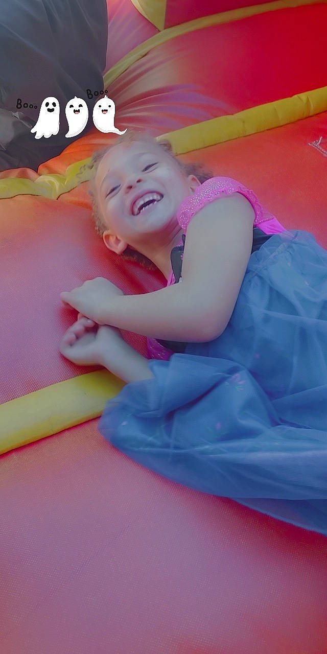 Miracle is registered to the contest to win money with this photo: baby, baby_playing_with_toys, baby_toddler_clothing, child, comfort, electric_blue, fun, happy, leisure, magenta, outdoor_play_equipment, person, pink, playground, recreation, shorts, sitting, smile, t_shirt, thigh