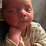 Xander is registered to the contest to win money with this photo: baby, newborn, sleeping, infant, close_up, hand, face, cozy, clothing, striped, cute, peaceful, portrait, soft_light, indoors, skin, young_child, resting, human, small