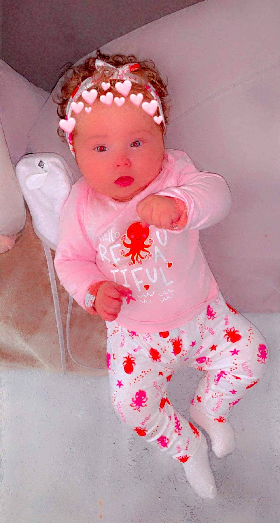 Lola participe au concours pour gagner de l'argent avec cette photo : baby, baby_products, baby_toddler_clothing, cheek, child, chin, eyelash, face, headpiece, headwear, lip, magenta, neck, nose, outerwear, pattern, peach, person, pink, skin