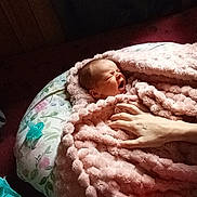 Emaleigh joined the competition — help win amazing prizes! baby, newborn, blanket, pink, yawning, hand, pillow, floral, sleeping, cozy, infant, wrapped, soft, indoor, resting, cute, child, person, toddler, nursery