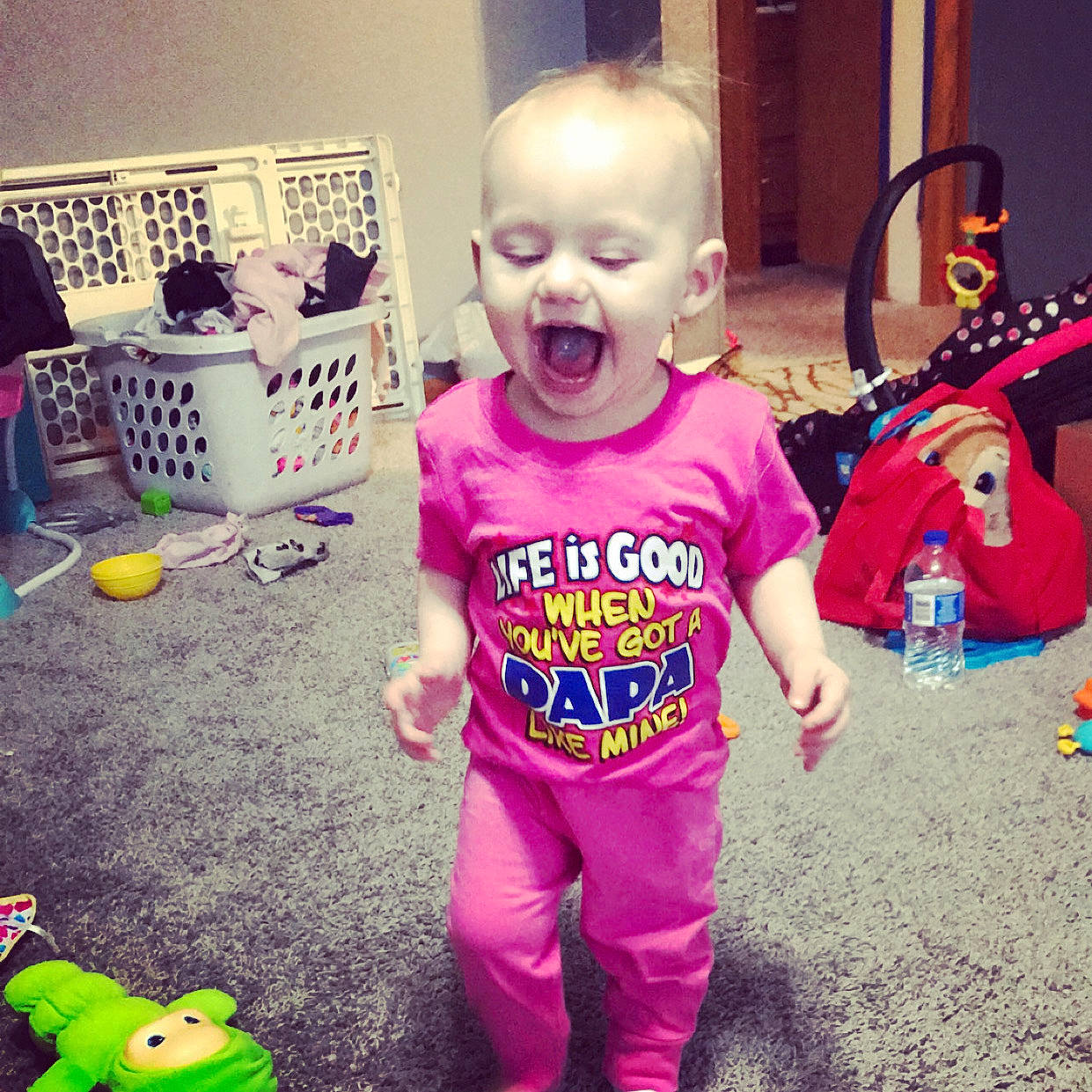 Kara is registered to the contest to win money with this photo: baby, child, cool, face, footwear, happy, head, pajamas, person, pink, play, product, purple, room, shoe, sleeve, smile, t_shirt, toddler, top