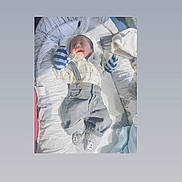 Rayshan joined the competition — help win amazing prizes! baby, infant, sleeping, smiling, mittens, suspenders, clothing, baby_nest, blanket, soft_toys, footwear, indoors, cute, peaceful, newborn, portrait, child, resting, cozy, comfortable