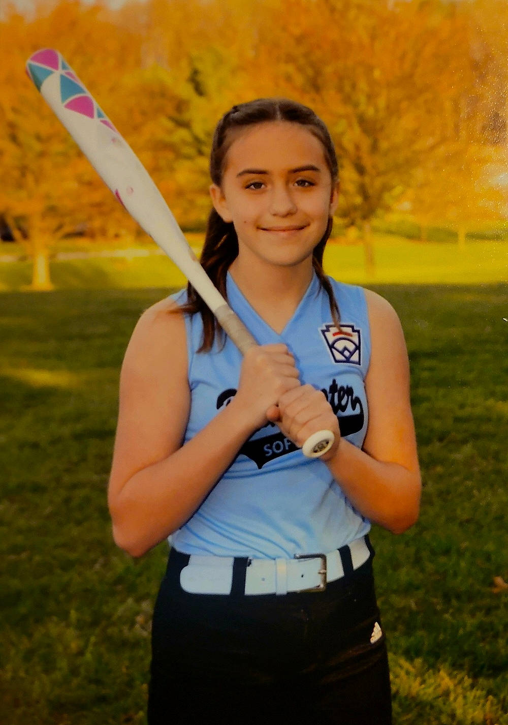 Kaelynn is registered to the contest to win money with this photo: athlete, belt, electric_blue, exercise, fun, gesture, grass, grassland, happy, joy, leisure, people_in_nature, person, plant, recreation, smile, sports, sports_equipment, t_shirt, tree