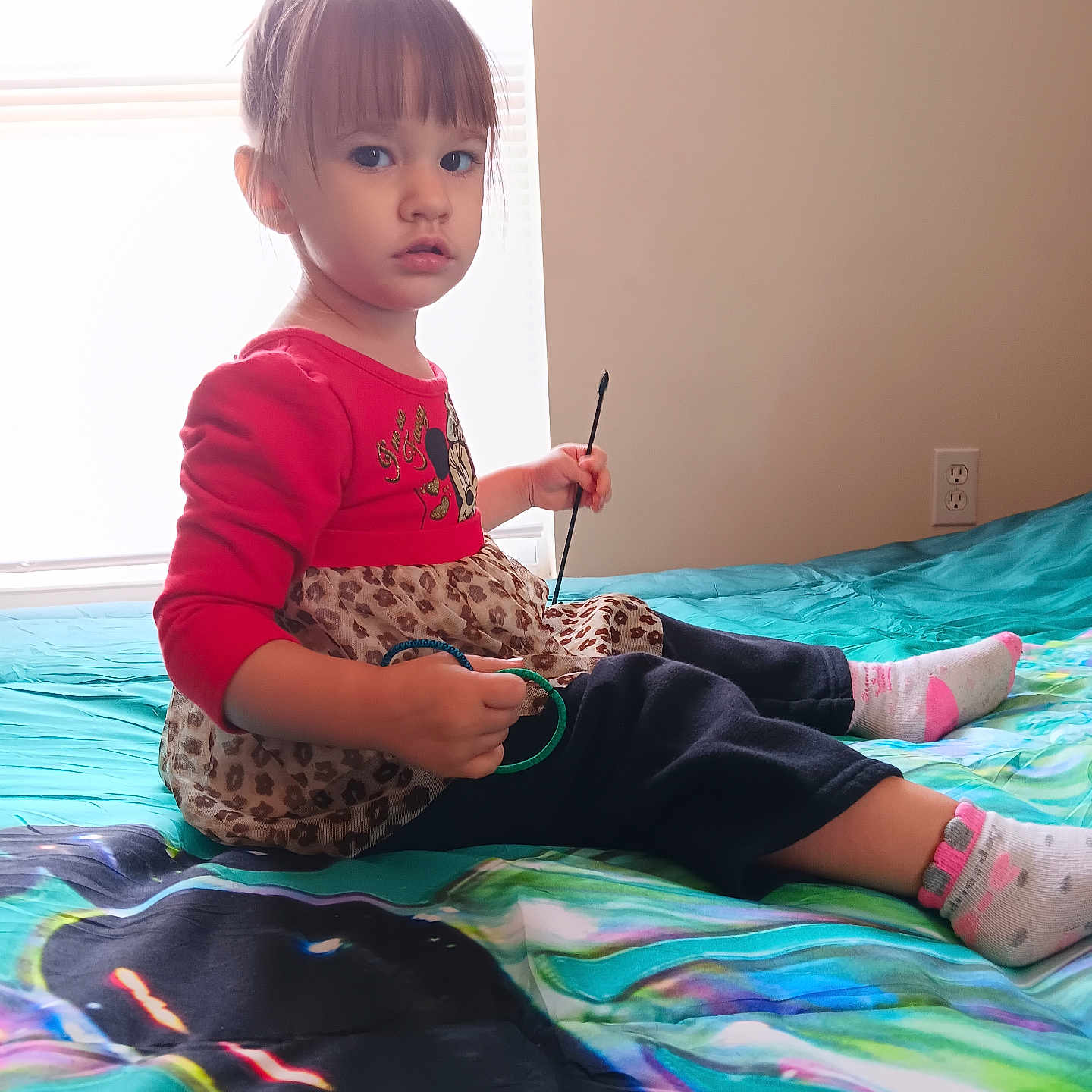 Leia is registered to the contest to win money with this photo: bodypart, boy, brush, child, clothing, device, face, finger, furniture, hand, head, hosiery, indoors, interiordesign, male, person, photography, portrait, sitting, sock