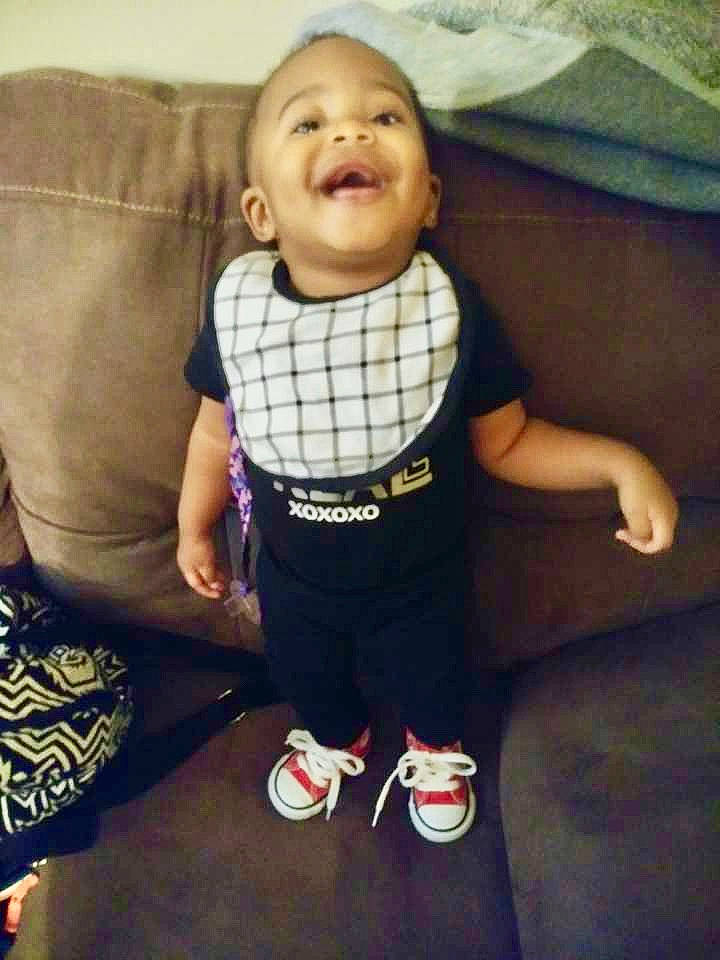 Neriah joined the competition — help win amazing prizes! baby, baby_toddler_clothing, cheek, child, cool, facial_expression, footwear, happy, laugh, pattern, person, plaid, product, shoe, sitting, skin, smile, t_shirt, tartan, toddler