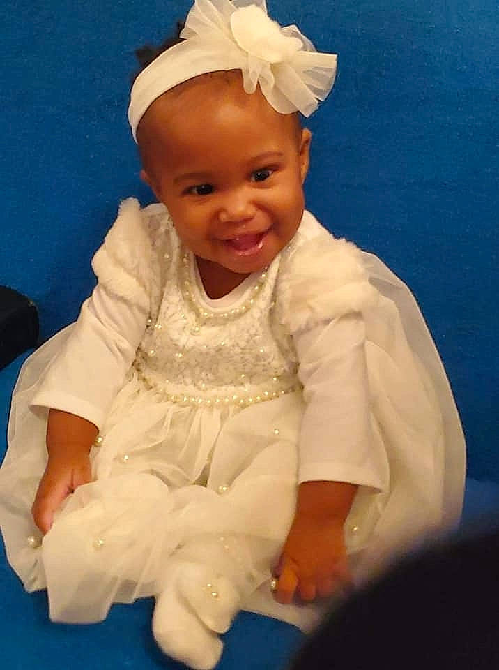 Neriah joined the competition — help win amazing prizes! baby, child, head, headgear, joy, person, sitting, smile, toddler