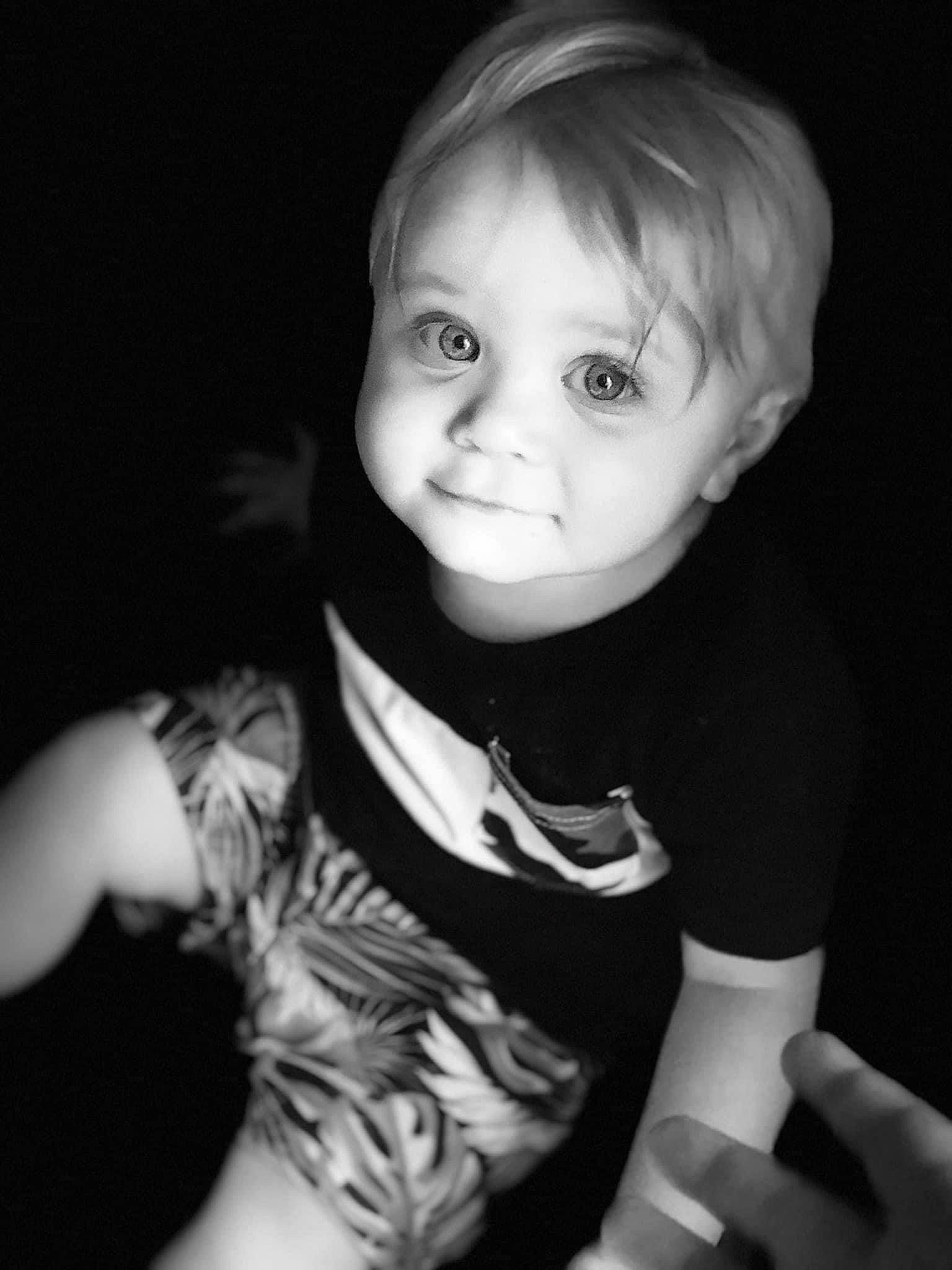 Spencer is registered to the contest to win money with this photo: baby_toddler_clothing, black, black_and_white, cheek, child, cool, eye, eyebrow, flash_photography, gesture, hairstyle, iris, lip, mouth, nose, person, skin, sleeve, smile, style
