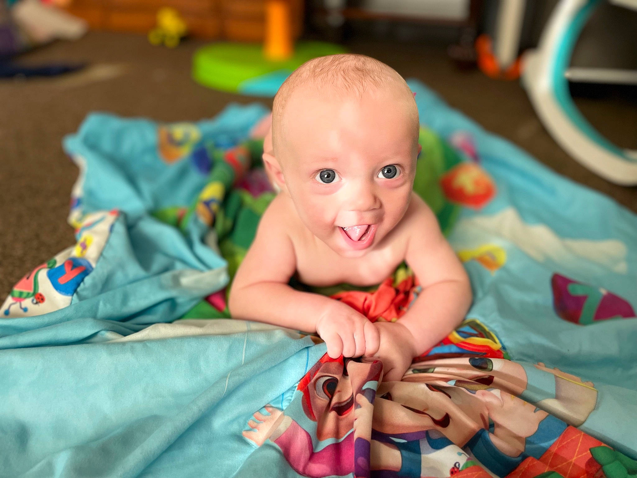 Parker joined the competition — help win amazing prizes! baby, baby_products, baby_toddler_clothing, cheek, event, eye, face, finger, flooring, fun, happy, human_body, iris, leisure, linens, person, play, sitting, skin, smile