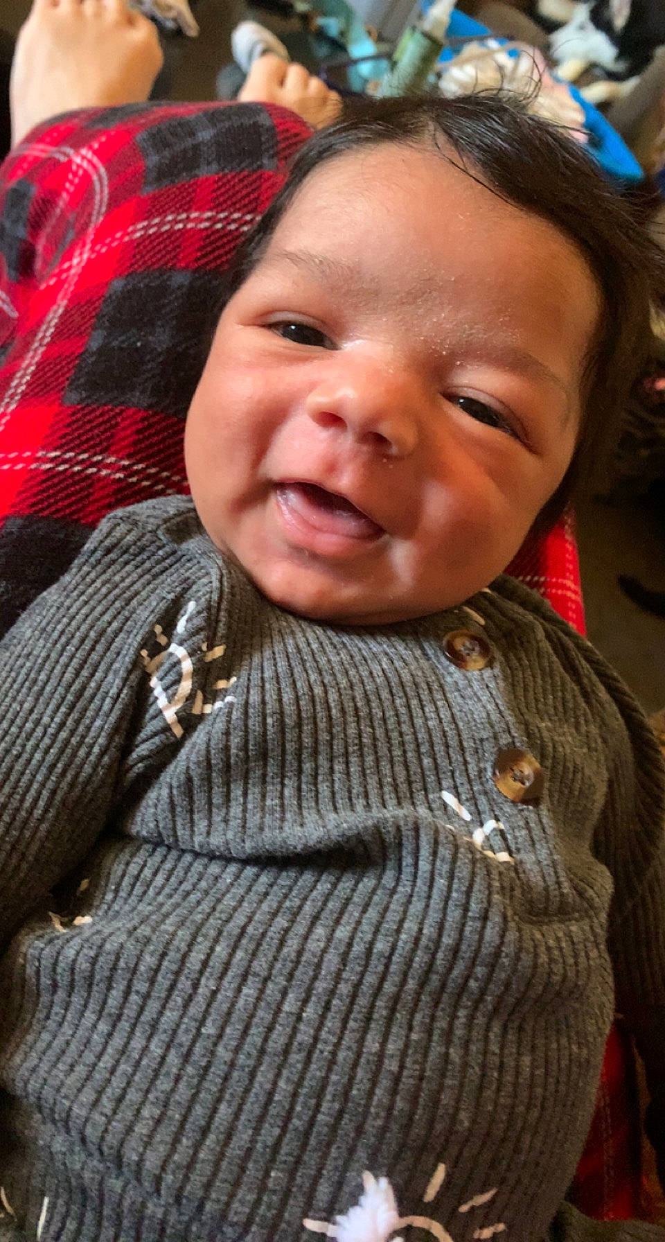 Blaze is registered to the contest to win money with this photo: baby, baby_toddler_clothing, cheek, child, chin, eyebrow, fun, happy, iris, lip, mouth, nose, pattern, person, plaid, skin, sleeve, smile, tartan, toddler