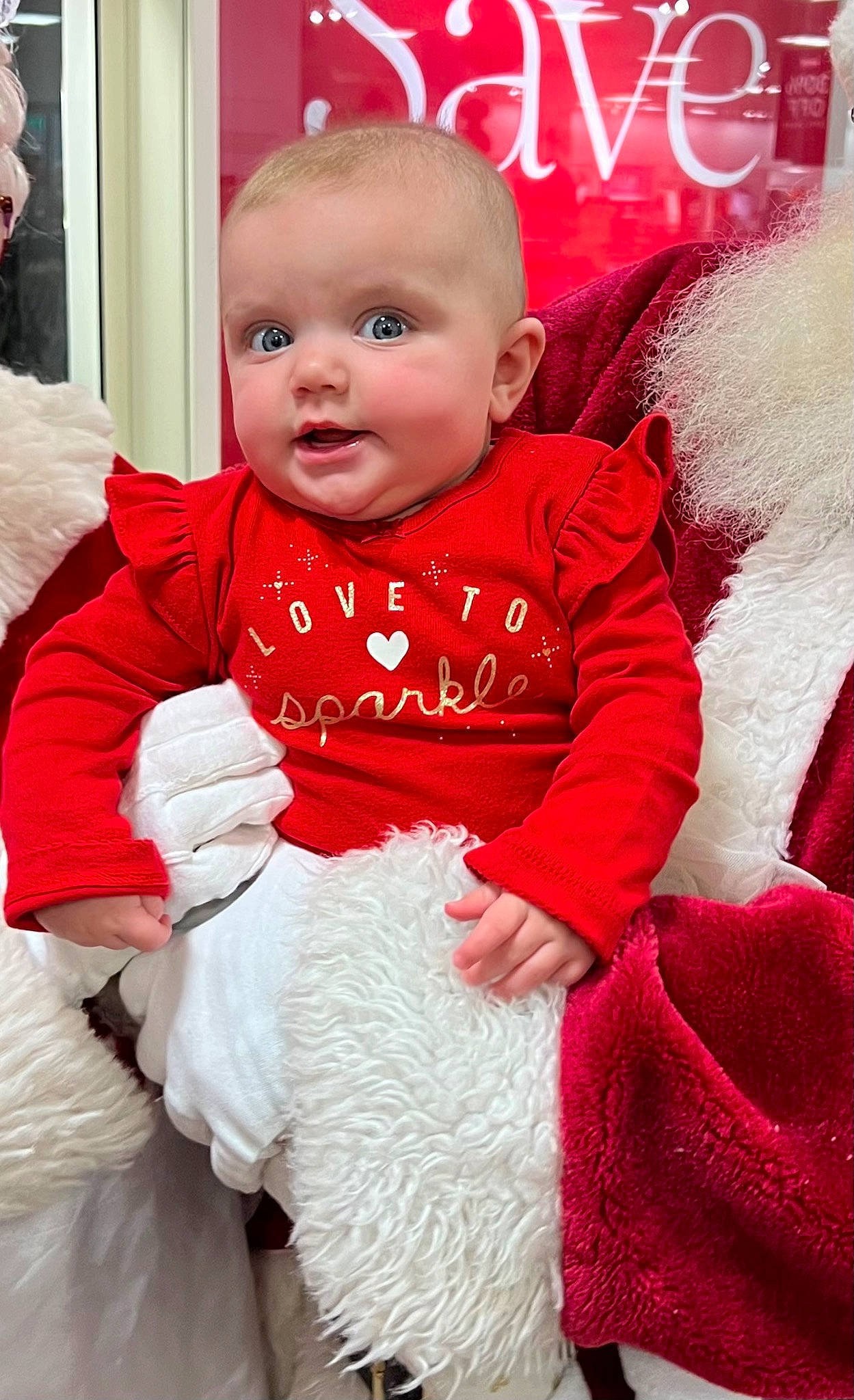 Everly is registered to the contest to win money with this photo: baby, baby_toddler_clothing, cheek, child, christmas, christmas_eve, collar, event, fur, fur_clothing, happy, linens, magenta, pattern, person, pink, sitting, skin, sleeve, smile