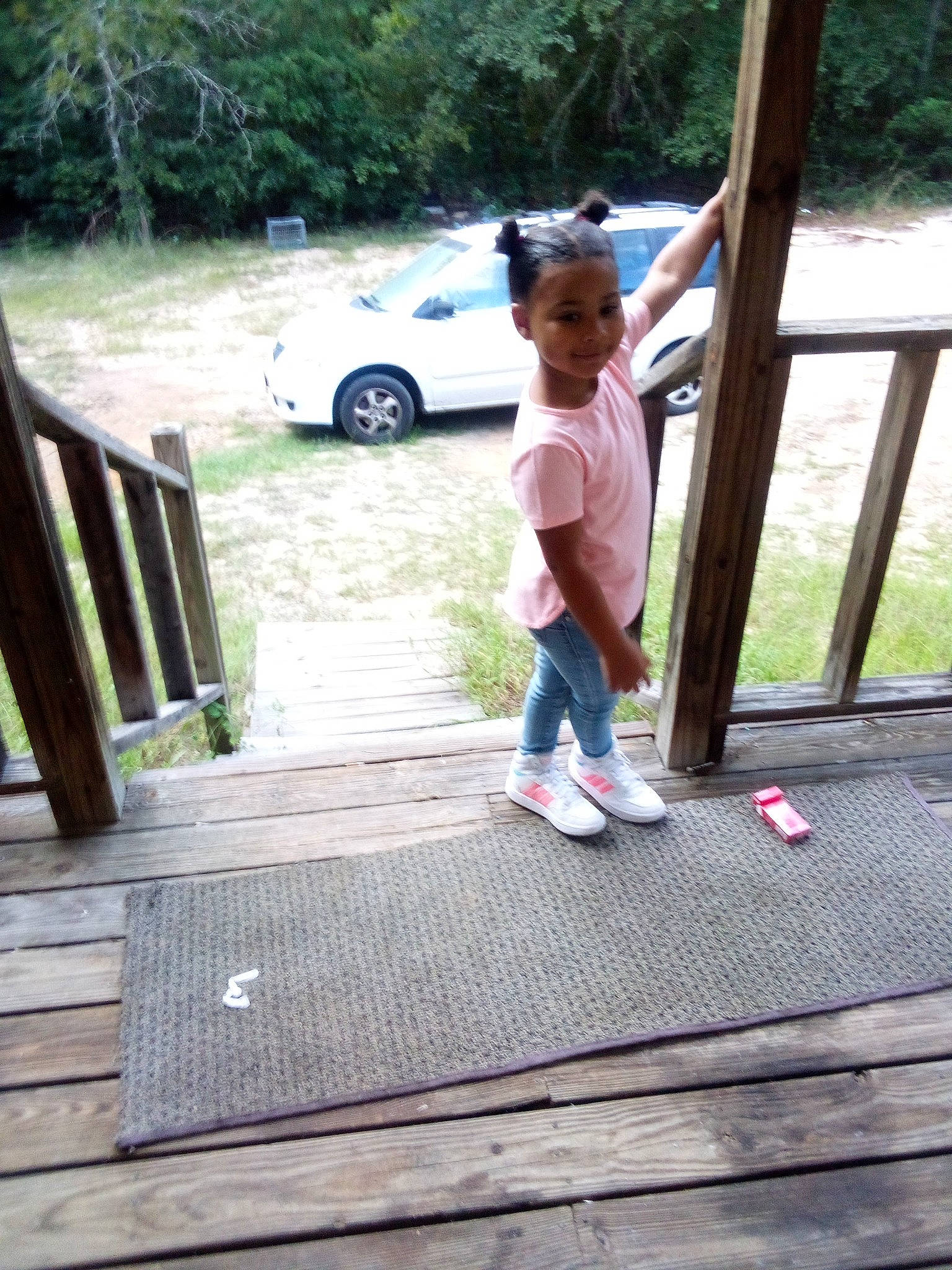 Ellianna is registered to the contest to win money with this photo: automotive_exterior, car, child, fun, grass, hardwood, landscape, leaf, leisure, person, plant, recreation, shorts, tints_and_shades, tire, toddler, tree, vehicle, vehicle_door, wheel