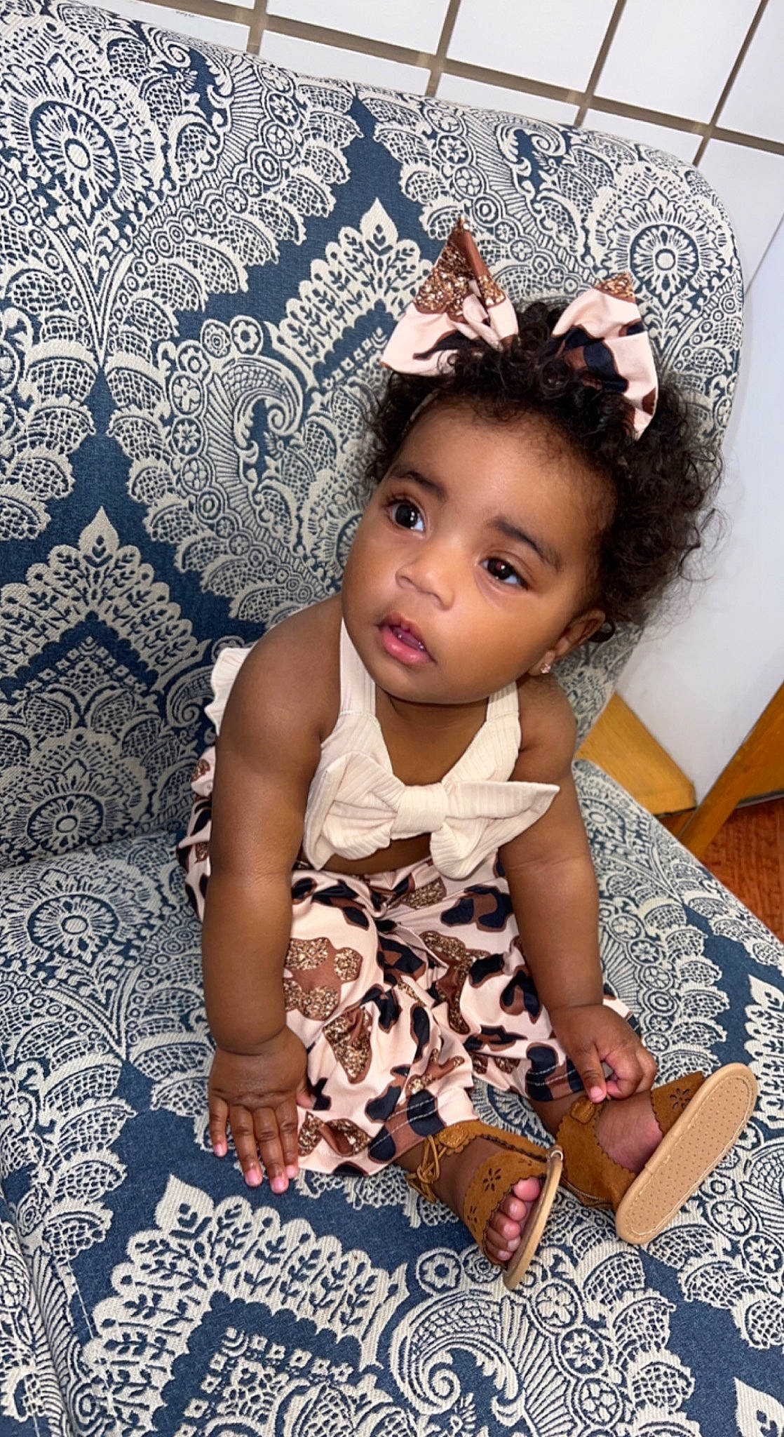 Lenox is registered to the contest to win money with this photo: baby_toddler_clothing, black_hair, child, face, fashion_accessory, fashion_design, flash_photography, flooring, fun, hair, happy, hat, head, headpiece, pattern, person, purple, sitting, skin, sleeve