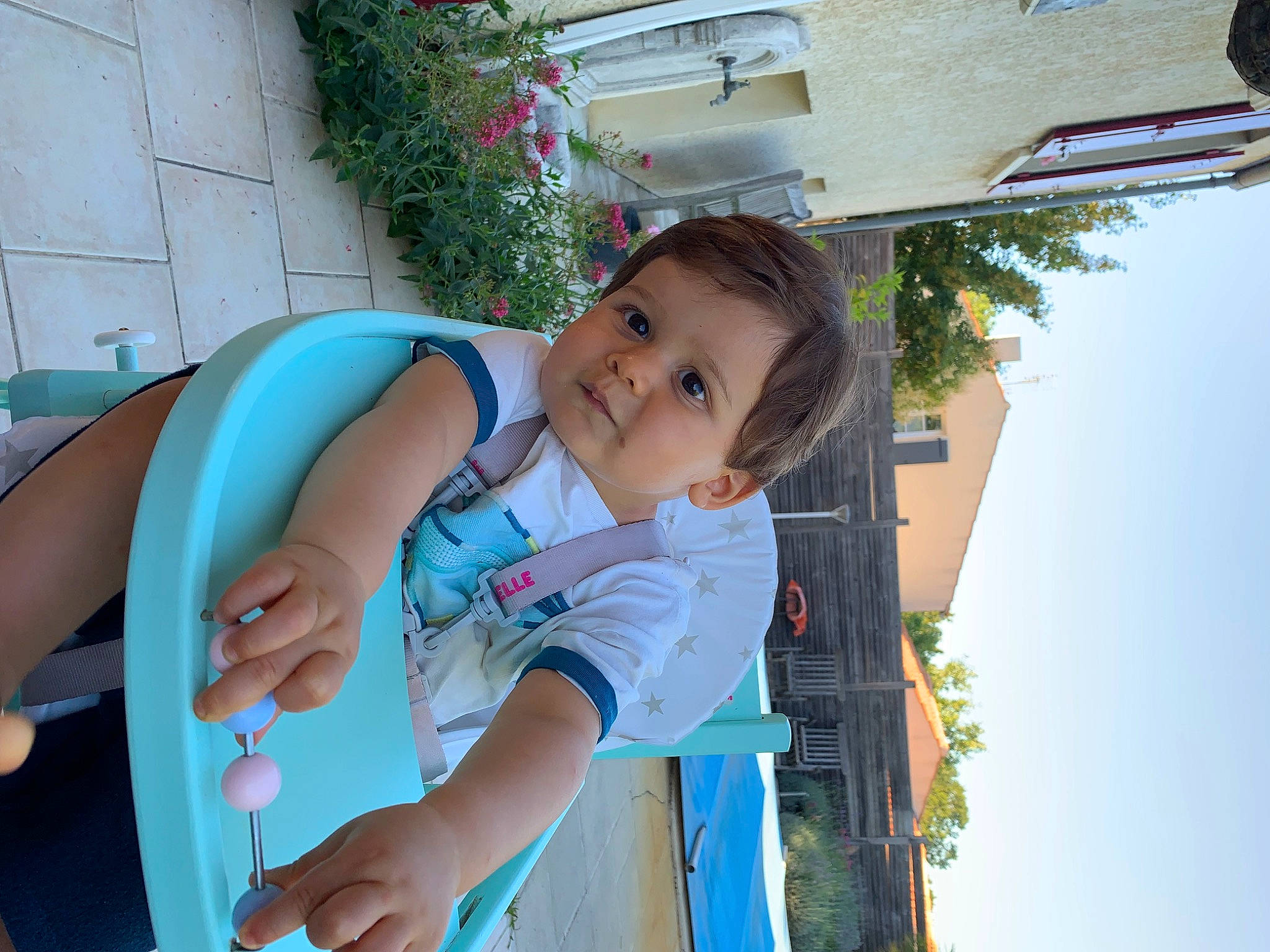 Deepan participe au concours pour gagner de l'argent avec cette photo : arm, azure, baby, baby_products, baby_toddler_clothing, child, electric_blue, eye, fun, happy, house, leisure, person, plant, recreation, sitting, sky, summer, toddler, tree