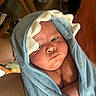 Hugo Lee is registered to the contest to win money with this photo: baby, infant, towel, blue_towel, wrapped, face, skin, expression, indoors, soft_texture, newborn, child, cute, pouty, curious, person, head, closeup, human, blanket