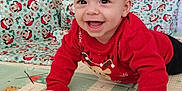 Nathan a rejoint le concours — aidez-le/la à gagner de superbes lots ! baby, child, smiling, crawling, red_sweater, reindeer, play_mat, holiday_decor, christmas, mickey_mouse, cushion, indoor, happy, festive, toy, floor, face, person, cute, seasonal