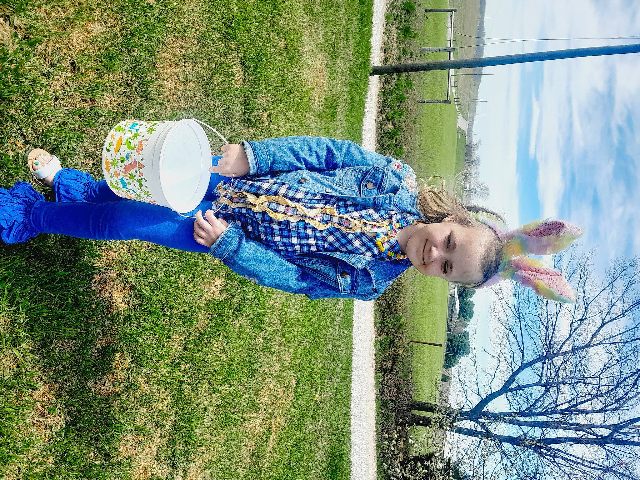 Hope is registered to the contest to win money with this photo: azure, child, electric_blue, fun, grass, happy, hat, human_leg, joy, leisure, people_in_nature, person, plant, recreation, shrub, sky, t_shirt, toddler, tree, vacation