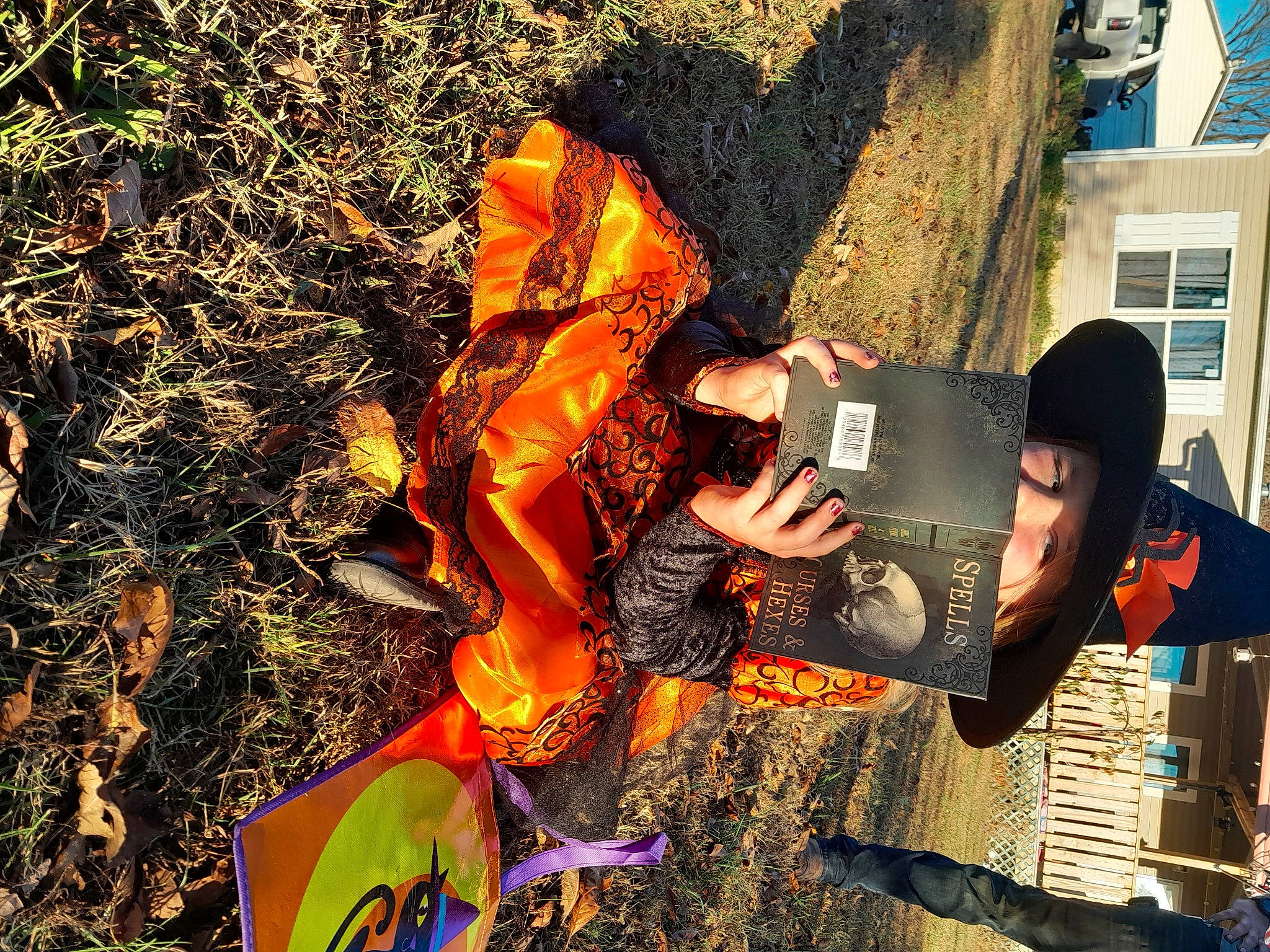 Faith joined the competition — help win amazing prizes! art, costume, event, fictional_character, fun, grass, hat, leisure, orange, people_in_nature, person, soil, tree, trick_or_treat, visual_arts, window