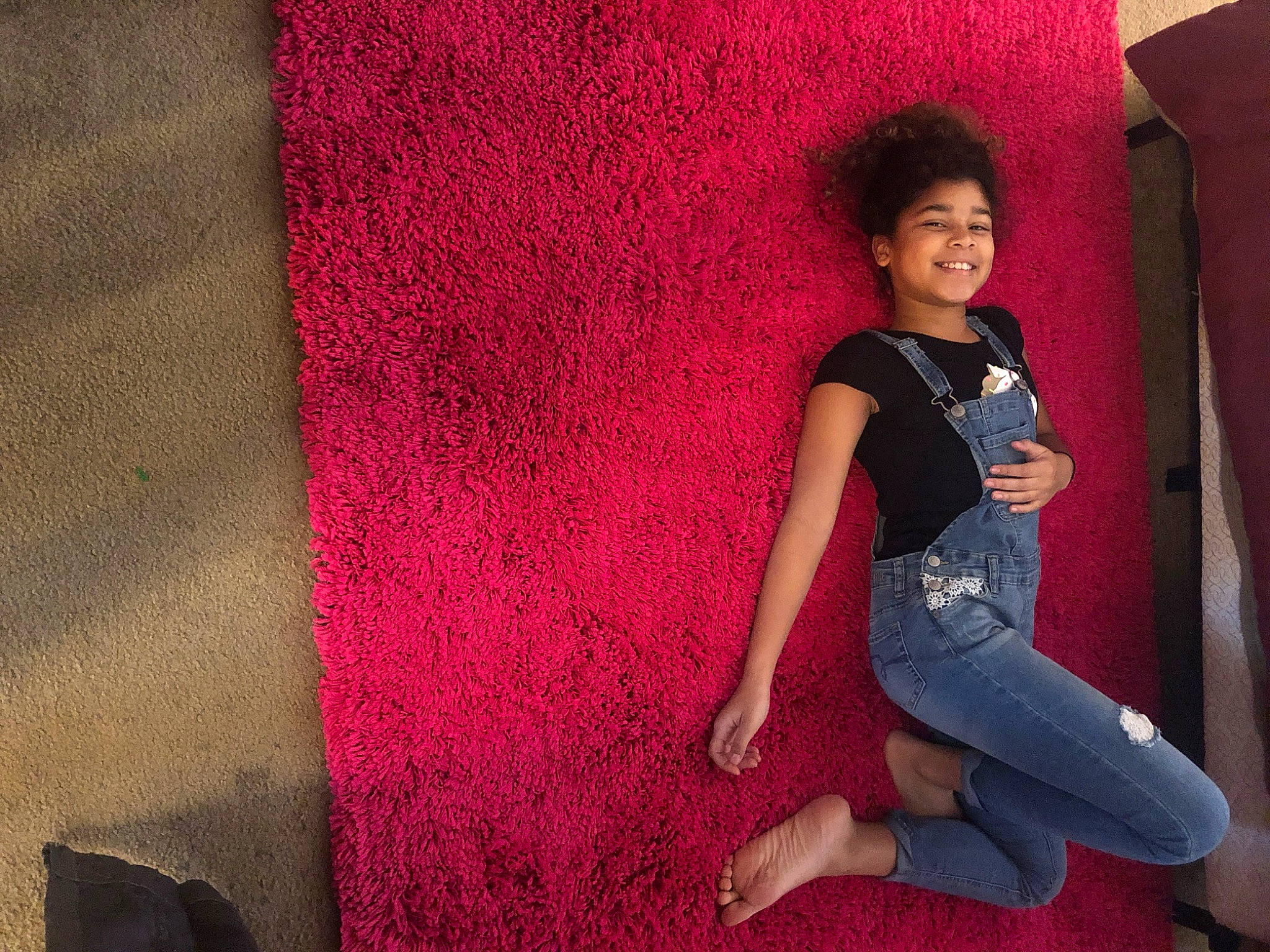 Julianne is registered to the contest to win money with this photo: beauty, black_hair, child, cool, fun, human, human_leg, jeans, joy, leg, leisure, long_hair, magenta, person, photography, pink, red, shoe, sitting, smile