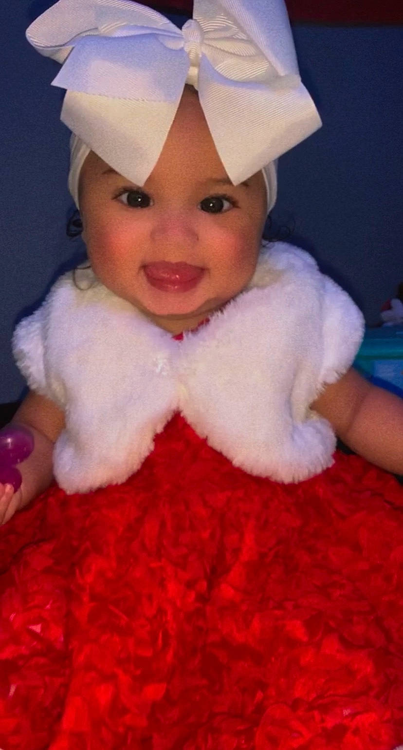 Suraya joined the competition — help win amazing prizes! baby, baby_laughing, baby_toddler_clothing, bonnet, cheek, child, cook, costume, costume_accessory, facial_expression, fictional_character, fur, happy, headgear, headwear, person, pink, pleased, toddler