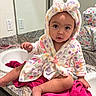Asiya is registered to the contest to win money with this photo: baby, child, bathrobe, hood, bow, bathroom, sink, mirror, towel, countertop, curious, sitting, cute, indoor, person, portrait, face, clothing, furniture, reflection