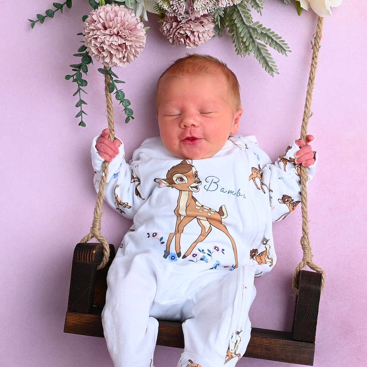 Esmae joined the competition — help win amazing prizes! baby, bambi, child, cute, feet, floral_arrangement, flowers, hands, indoors, infant, newborn, onesie, peaceful, pink_background, portrait, rope, sleeping, soft_lighting, swing, wooden_swing