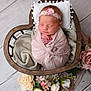 Esmae is registered to the contest to win money with this photo: newborn, baby, sleeping, swaddle, headband, flower, wooden_basket, heart_shaped, blanket, soft_texture, pink, white, flower_arrangement, flooring, portrait, cute, peaceful, infant, resting, cozy