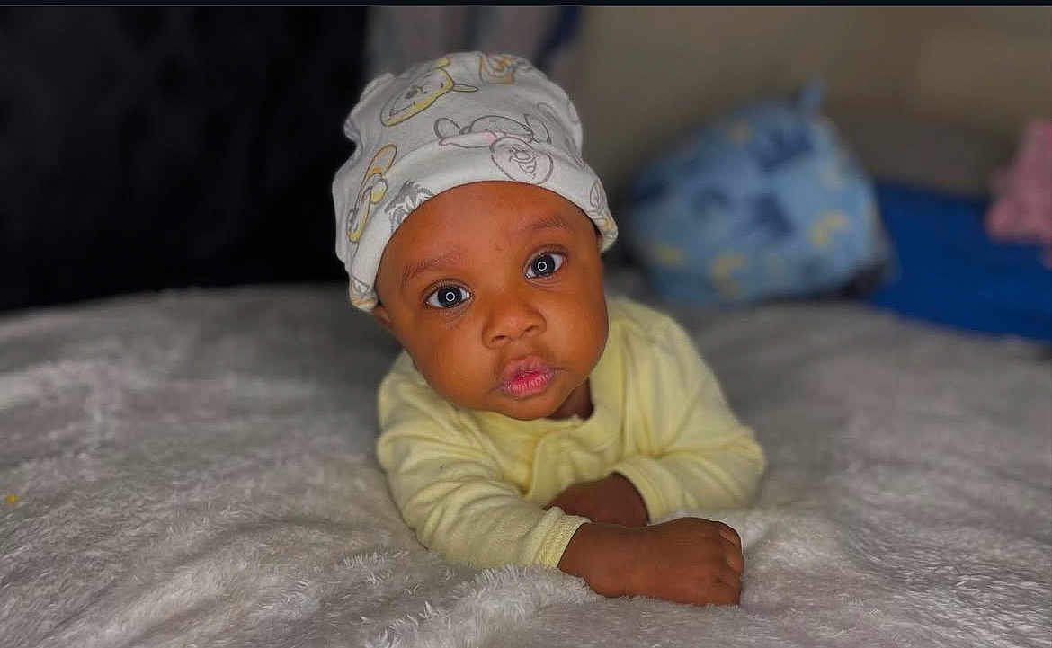 Legend joined the competition — help win amazing prizes! baby, bonnet, cap, clothing, crawling, face, happy, hat, head, newborn, person, photography, portrait, smile