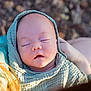 baby, infant, sleeping, hoodie, soft_texture, closeup, natural_light, outdoor, peaceful, person, child, portrait, skin, head, face, hand, warm_clothing, blurred_background, resting, newborn