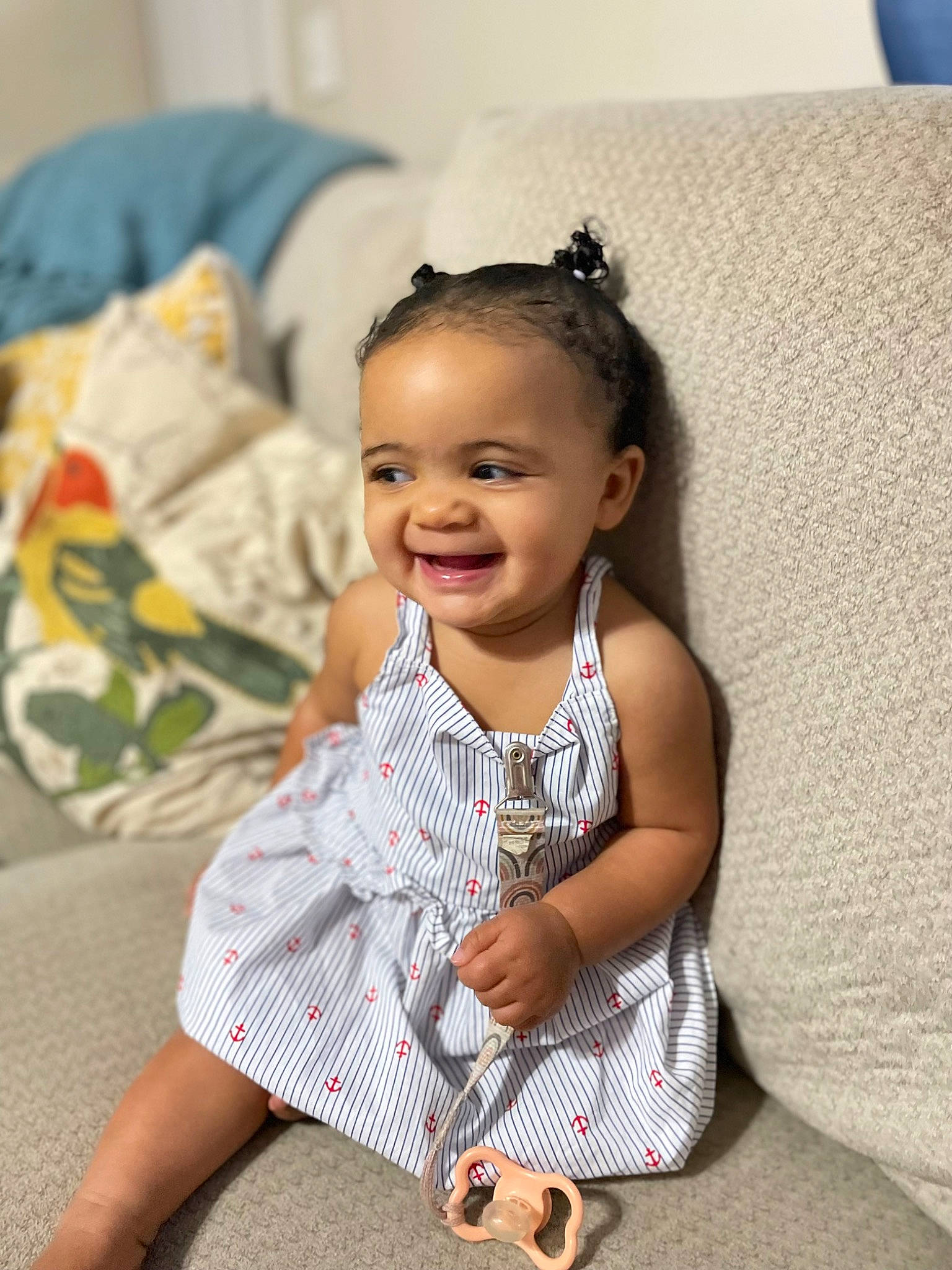 Aleigha is registered to the contest to win money with this photo: arm, baby, baby_toddler_clothing, blue, cheek, child, comfort, dress_shirt, eye, fashion_accessory, flash_photography, hand, happy, joy, pattern, person, sitting, skin, sleeve, smile