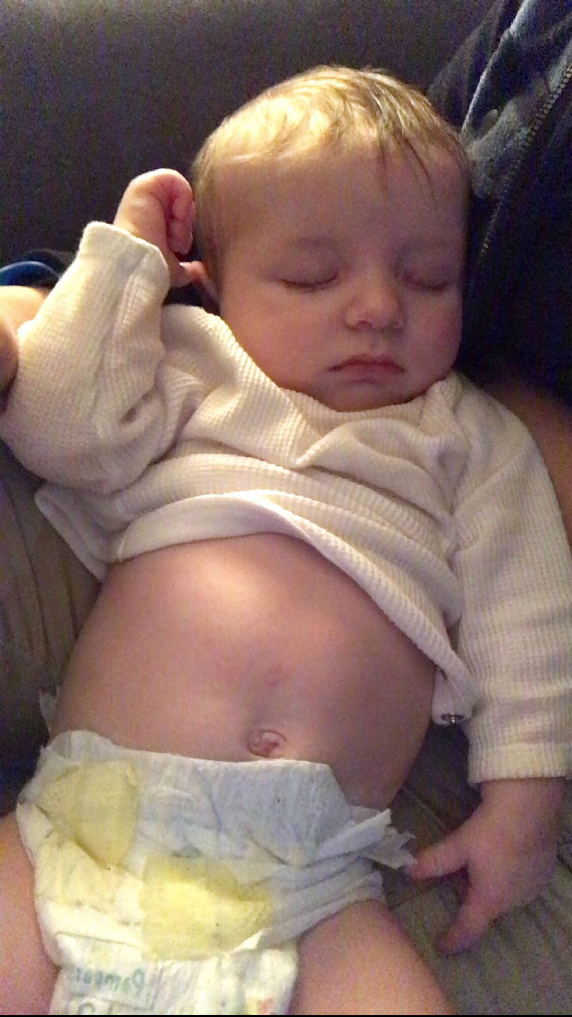 Adrian is registered to the contest to win money with this photo: arm, baby, baby_toddler_clothing, cheek, chin, comfort, finger, gesture, head, human_body, lip, mouth, muscle, neck, nose, organ, person, skin, sleeve, stomach