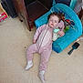 bottle, carpet, chair, child, cozy, curly_hair, cute, floor, furniture, indoor, milk, nap, onesie, paw_patrol, relaxed, sleeping, socks, toddler, toy, wooden_furniture