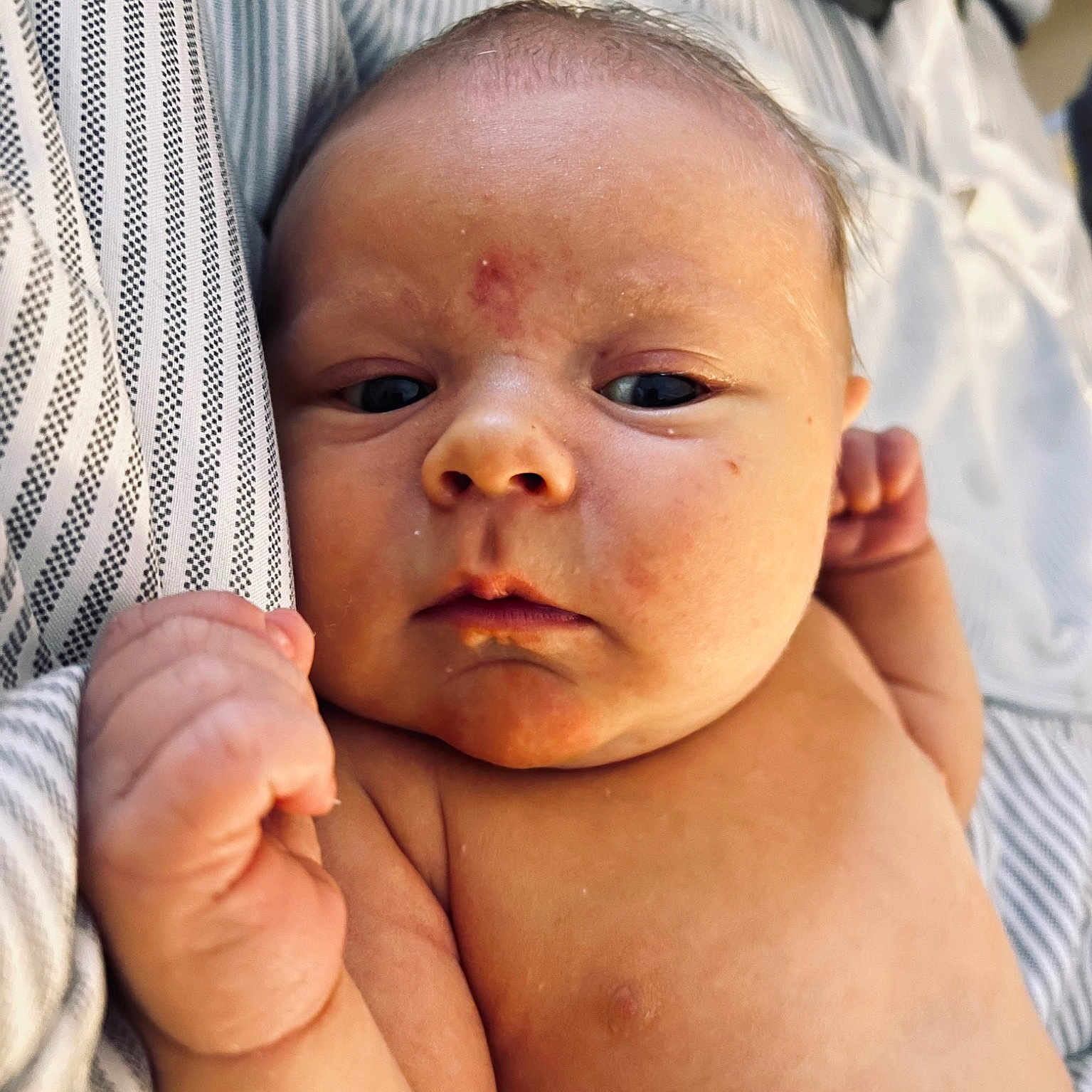 Hayes is registered to the contest to win money with this photo: baby, cheek, chin, comfort, eye, eyebrow, eyelash, facial_expression, finger, forehead, gesture, happy, human_body, lip, mouth, neck, nose, skin, stomach, thumb