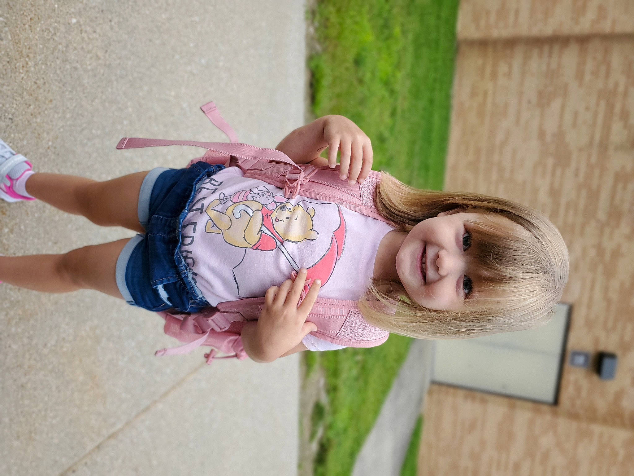 Elliott is registered to the contest to win money with this photo: child, fun, grass, happy, human_leg, joy, knee, leisure, magenta, person, pink, plant, recreation, sandal, sitting, skin, smile, thigh, toddler, tree
