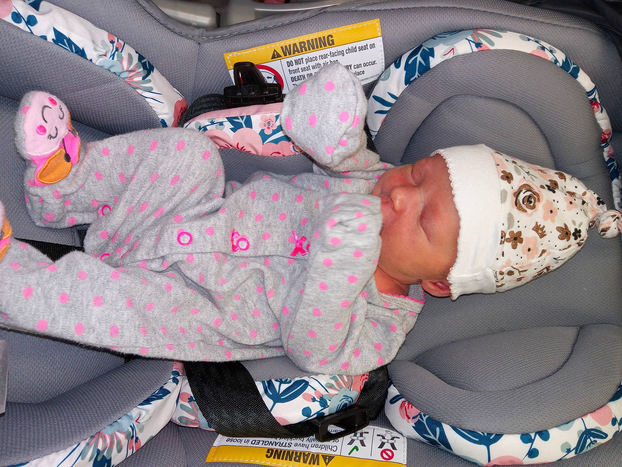 Kymber is registered to the contest to win money with this photo: auto_part, baby, baby_products, baby_sleeping, baby_toddler_clothing, cap, car_seat, carmine, child, comfort, design, fedora, hat, headwear, lap, linens, motor_vehicle, pattern, person, sun_hat