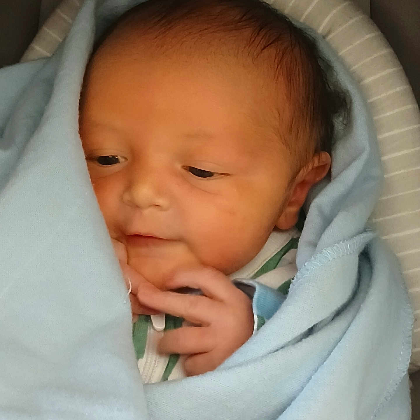 Twahn is registered to the contest to win money with this photo: newborn, baby, blanket, blue_blanket, infant, wrapped, sleepy, soft, cute, face, hand, skin, portrait, closeup, indoors, child, baby_clothes, head, peaceful, resting