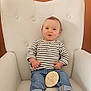Noah a rejoint le concours — aidez-le/la à gagner de superbes lots ! baby, child, infant, striped_shirt, jeans, barefoot, white_chair, wooden_sign, 10_months, sitting, indoor, portrait, cute, smiling, curious, young_child, comfortable, plush_chair, rolled_jeans, light_brown_hair