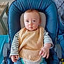Noah a rejoint le concours — aidez-le/la à gagner de superbes lots ! baby, infant, blue_eyes, bib, striped_clothing, baby_seat, cushion, indoor, curious, small_hands, child, young, casual_clothing, furniture, soft_textile, person, cute, seated, home, portrait