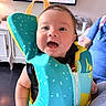 baby, child, smiling, life_jacket, indoor, person, blue_shirt, happiness, portrait, cute, infant, clothing, colorful, face, young_child, happy, closeup, arm, zipper, background