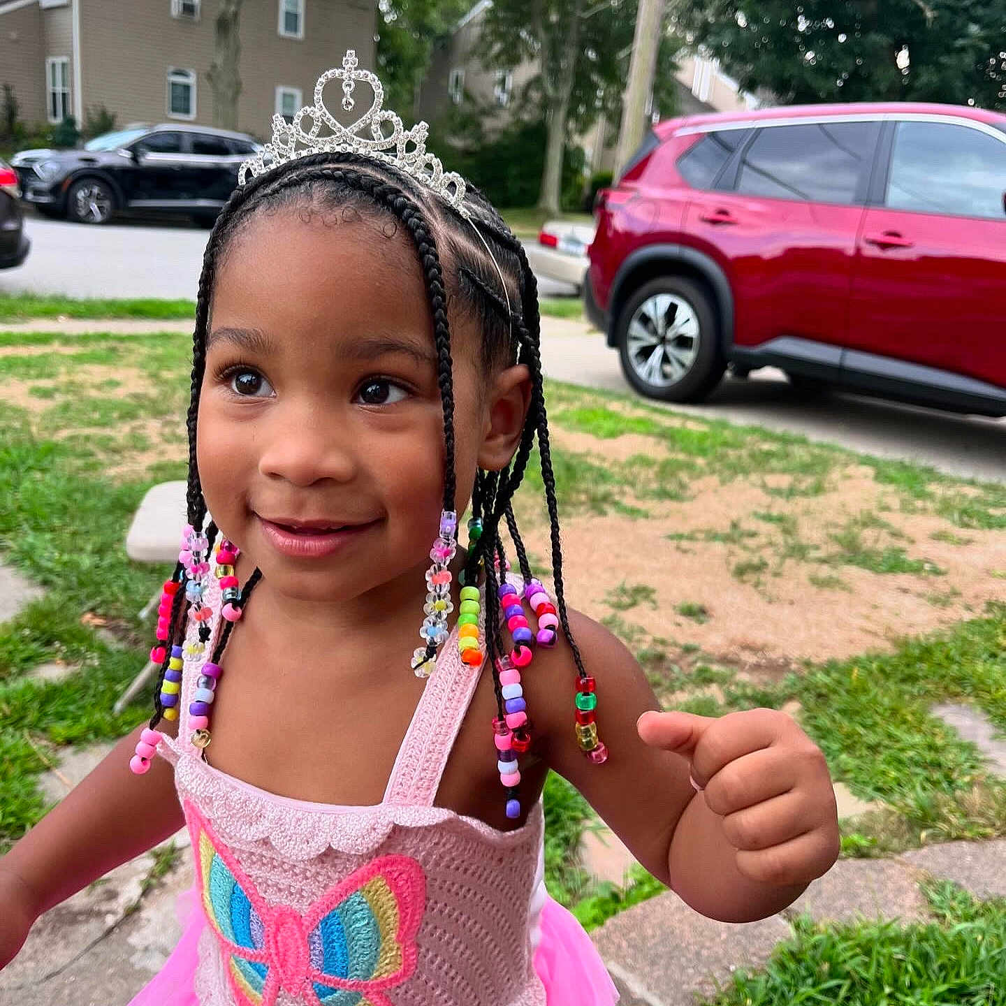 Mila is registered to the contest to win money with this photo: alloywheel, car, carwheel, child, face, female, girl, grass, head, machine, person, photography, plant, portrait, sedan, spoke, tire, transportation, vehicle, wheel